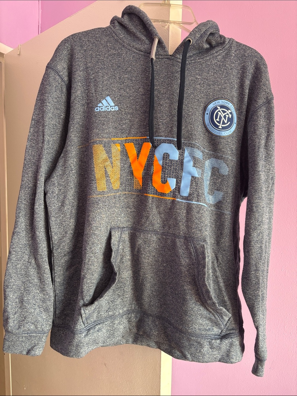 NYCFC hoodie. 
Size M - good for a petite woman or boy